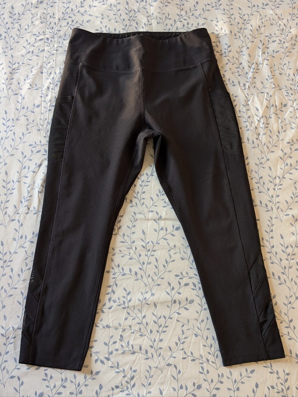 Mondetta black workout leggings with mesh ankle cutouts